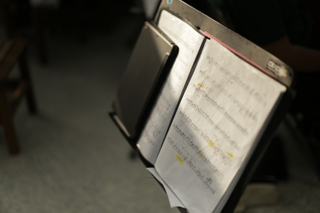 Music tutor giving piano lesson to student in our studio